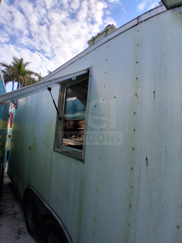 Commercial kitchen trailer with grease hood, Dean fryers, Sierra griddle, Wells cooktop, and Arctic Air refrigeration.