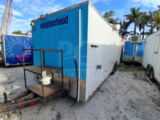 Commercial kitchen trailer with grease hood, Dean fryers, Sierra griddle, Wells 4-burner cooktop, Arctic Air refrigeration suite.