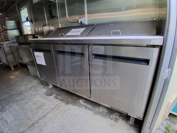 Commercial kitchen trailer, featuring grease hood, Dean fryers, Sierra griddle, Wells 4-burner cooktop, Arctic Air refrigeration.