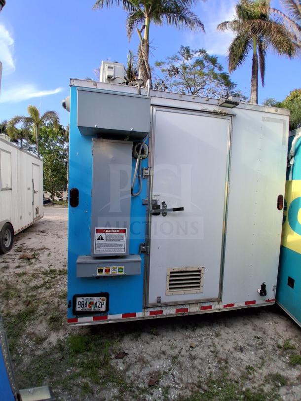 Commercial kitchen trailer with grease hood, Dean fryers, Sierra griddle, Wells 4-burner cooktop, Arctic Air refrigeration.