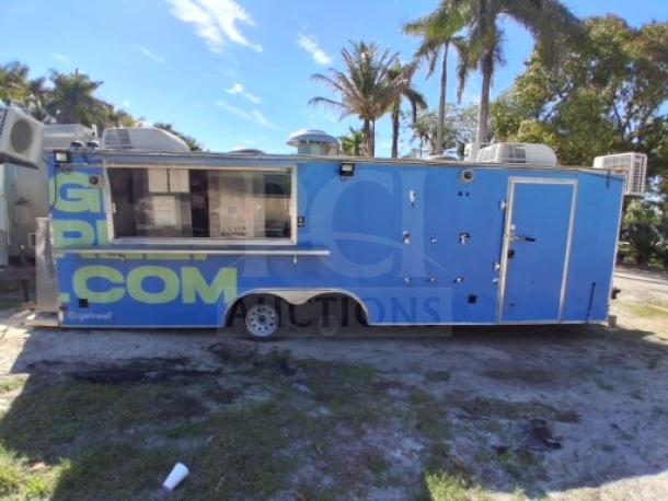Blue food trailer with commercial kitchen equipment, safety systems, and utility features. Needs minor improvements.