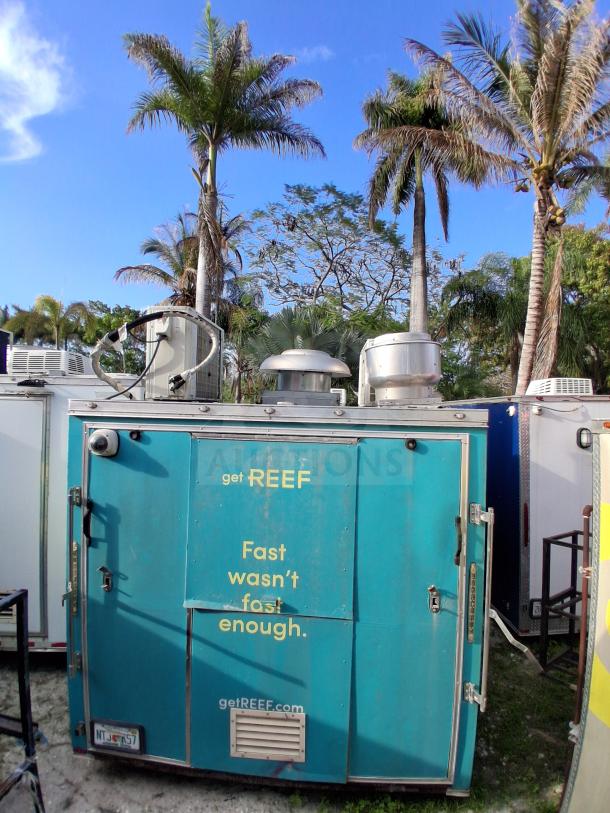 Mobile kitchen trailer with "get REEF" branding, equipped with commercial refrigeration, fire suppression, and climate control, model F106.