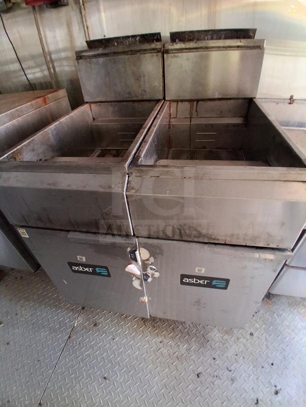 Professional mobile kitchen with Asber fryers, featuring commercial-grade equipment. Used condition, ideal for food service.
