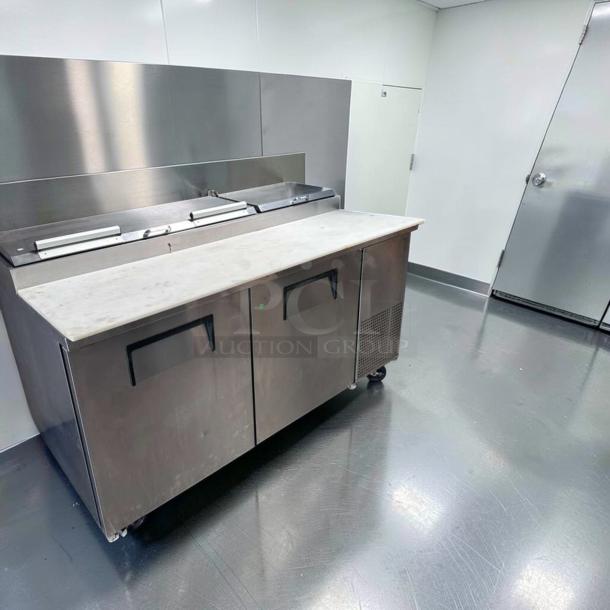 Outstanding condition True TPP-AT-67-HC pizza prep table with marble top, 2-door refrigerated base, 67", 115V, fully tested.