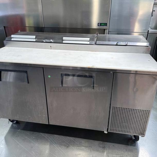 True TPP-AT-67-HC pizza prep table with marble top, 2-door refrigerated base, outstanding condition, 115V, fully tested.