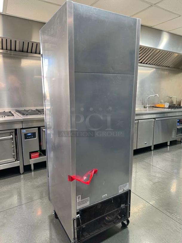 Stainless steel True T-23F-HC 23 Cu. Ft. reach-in freezer, flawless condition, commercial grade, 115V, tested operational.