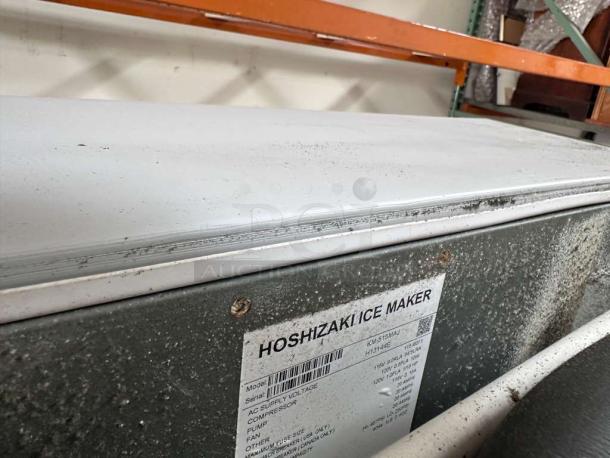Hoshizaki KM-520MAJ commercial ice machine with storage bin, 556 lb/day, air-cooled, stainless steel, label indicates model info.