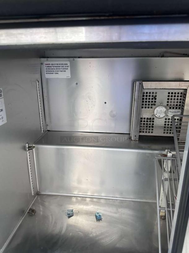 Exceptional True TUC-48G-HC undercounter refrigerator interior, stainless steel, two glass doors, tested, 115V, auction item.