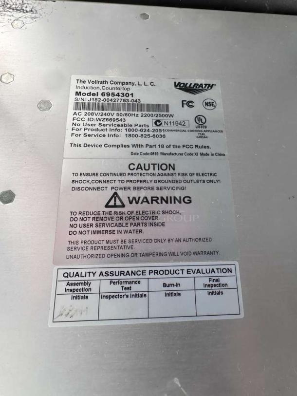 Vollrath 6954301 induction range label; model, voltage 240V, serial number visible, caution and quality assurance details included.