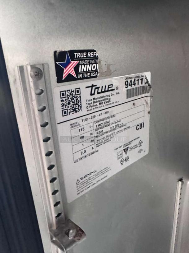 True TUC-27F-HC-LP undercounter freezer label, showing model, serial number, and 115V power specs, stainless steel.