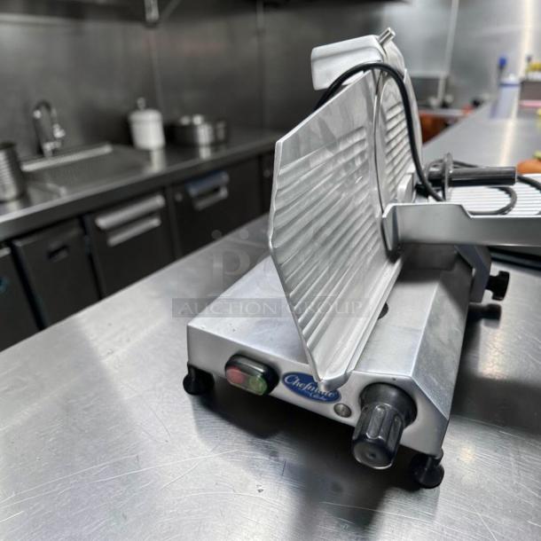 Globe C10 Chefmate meat slicer, 10" blade, belt-driven, stainless steel, excellent condition, fully operational, model tag visible.