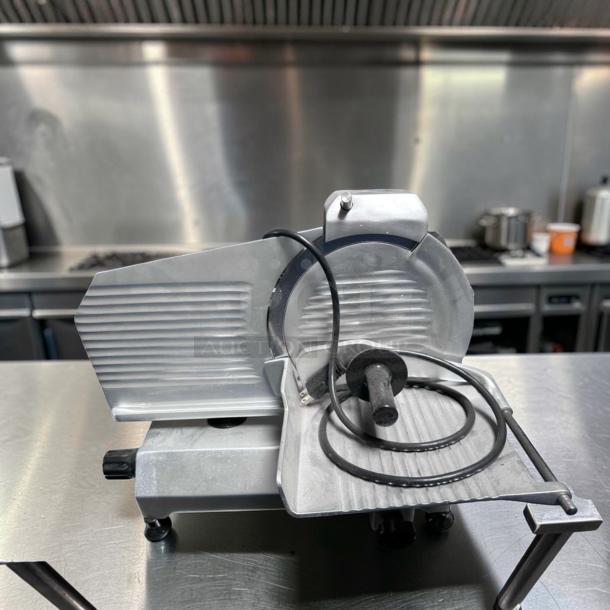 Globe C10 Chefmate manual meat slicer, 10" blade, stainless steel, belt-driven, 1/4 HP, excellent condition, 115V.