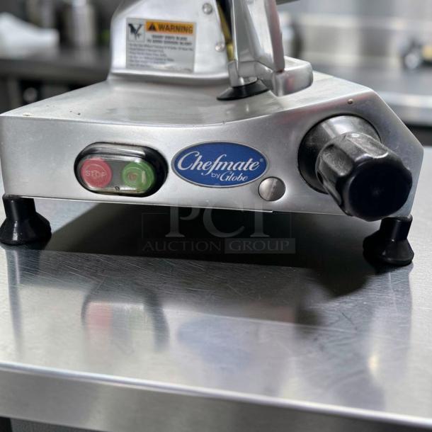 Globe C10 Chefmate manual meat slicer, 10" blade, stainless steel, belt driven, 1/4 HP, excellent condition, 115V, stop/start buttons.