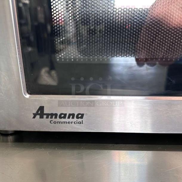 Amana RMS10DSA Commercial Microwave Oven, stainless steel, dial controls, 1000W, 120V, logo visible, in exceptional condition.