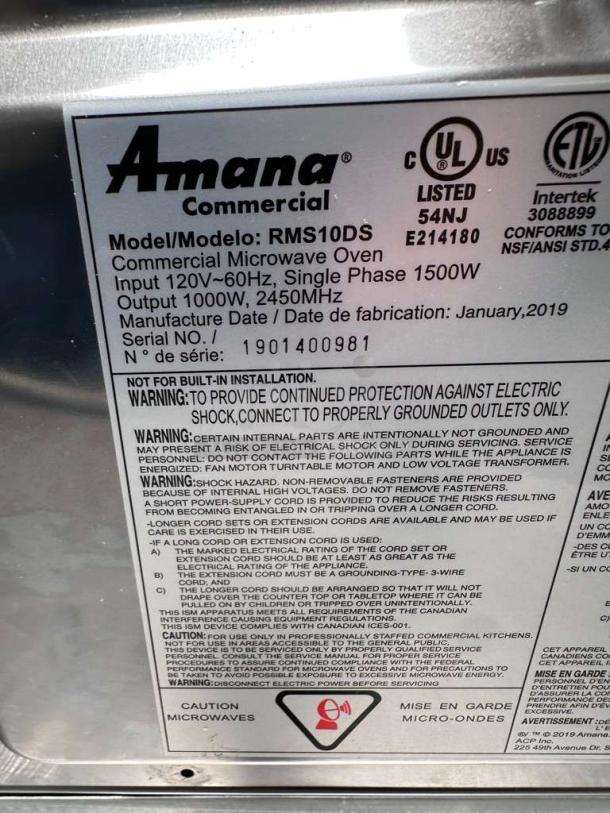 Amana RMS10DSA Commercial Microwave Oven label showing model, 1000W output, 120V, manufactured January 2019, warnings, and certifications.