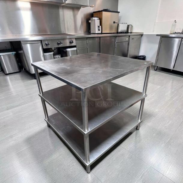 Superior condition 34" x 34" stainless steel commercial work table, double shelf, heavy-duty, fully tested, ready for use.