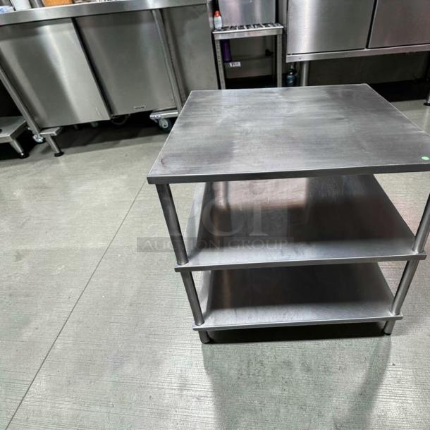34" x 34" stainless steel commercial work table with double shelves. Superior condition, heavy-duty, fully tested; ideal for food prep.