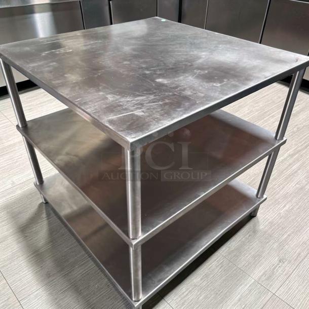 Stainless steel commercial work table, 34"x34", with double shelves, superior condition. Ideal for food prep, fully tested.