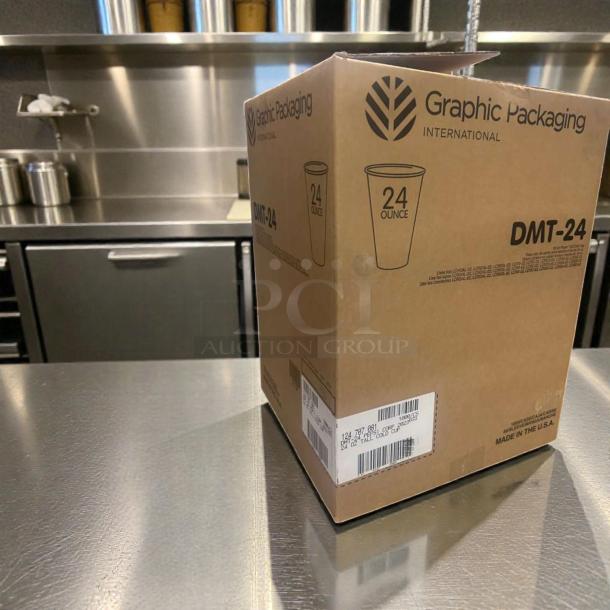 Box of Graphic Packaging DMT-24 24 oz Tall Paper Cold Cups, champagne design, new condition, bulk case, labeled.