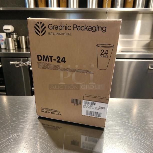 Graphic Packaging DMT-24 24 oz paper cold cups box, new condition, Champagne design, labeled for commercial use.