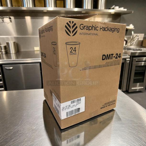 Box of Graphic Packaging DMT-24 24 oz paper cold cups, champagne design, new condition, labeled "Made in the USA."