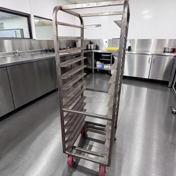 Commercial stainless steel bun pan rack, mobile and heavy-duty. Superior condition, holds multiple trays, tested operational.