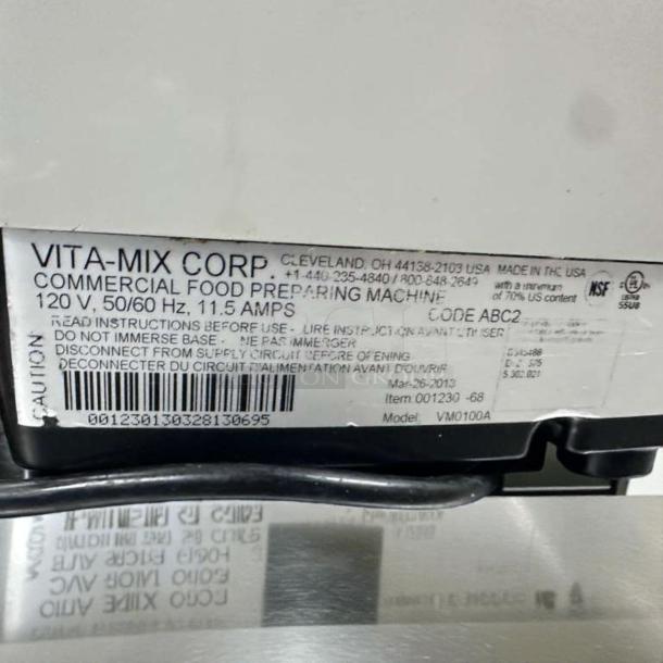 Vitamix VM0100A blender label showing model, voltage, and caution details. Made by Vitamix Corp, USA.