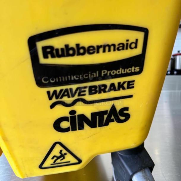 Rubbermaid WaveBrake 35 Qt. yellow commercial mop bucket with side press wringer, Cintas logo, excellent condition.