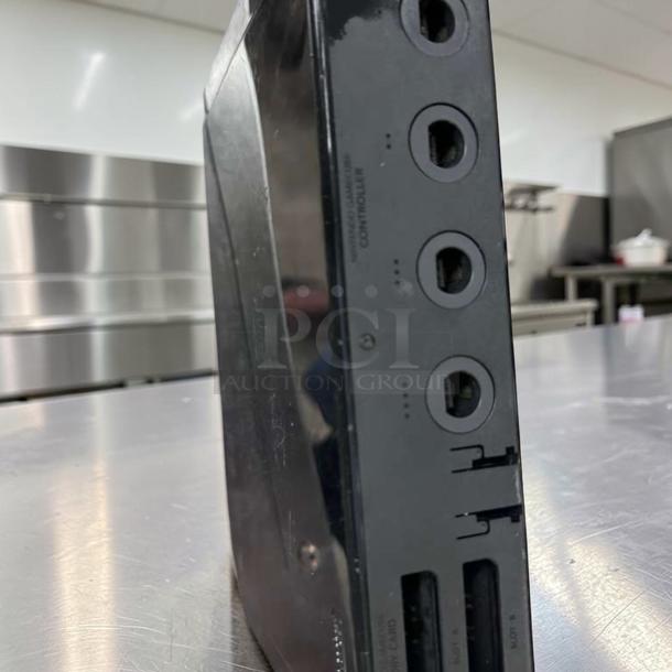 Nintendo Wii RVL-001 black console, excellent condition, GameCube compatible, fully tested, region free, side view showing ports.