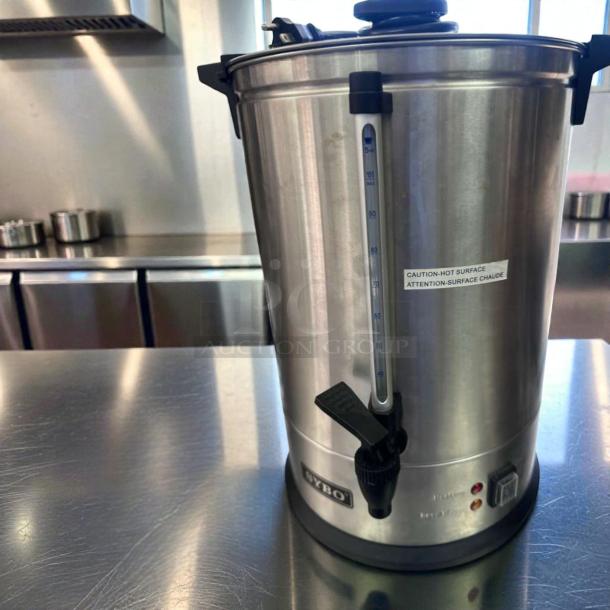 SYBO 100 Cup Coffee Urn, 16L, stainless steel, immaculate condition, hot water dispenser, caution label visible.