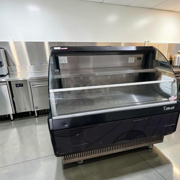 Turbo Air TOM-50LB-N 50" open air merchandiser, black finish, pristine condition, tested, operational, model tag visible.
