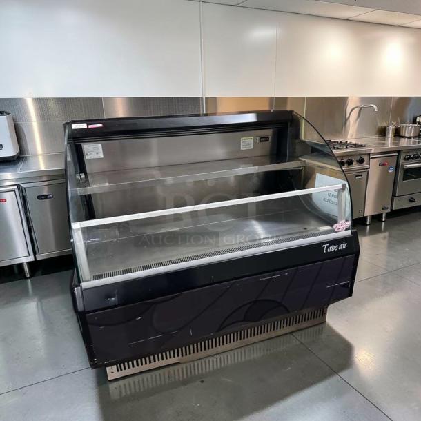 Turbo Air TOM-50LB-N 50" open air merchandiser, black finish, pristine condition, fully operational, tested, labels visible.