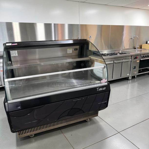Turbo Air TOM-50LB-N 50" open air merchandiser in black. Pristine condition, horizontal air curtain, fully tested.