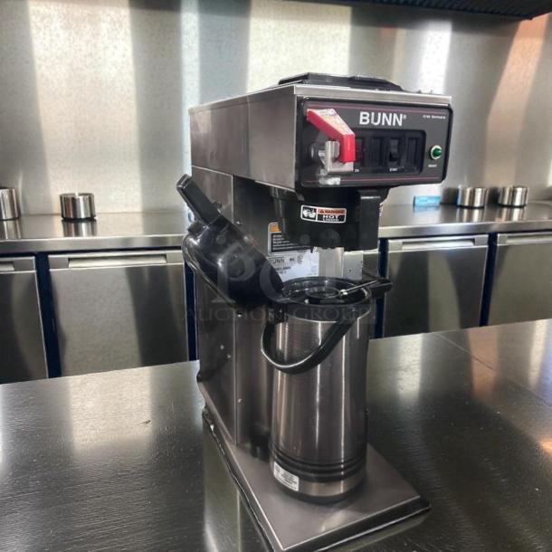 Bunn CWTF15-APS coffee brewer in outstanding condition, 120V, hot water faucet, commercial use, fully operational, stainless steel.