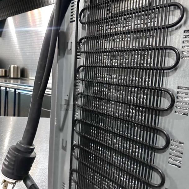 Alt text: Douwe Egberts Cafitesse 300 NG-300 coffee machine rear view, showcasing coil and power plug; elite condition.