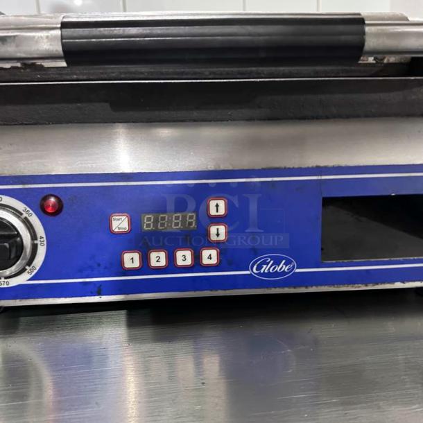 Globe GSG14D Deluxe Panini Grill, 14"x14" smooth plates, stainless, 120V, digital display, start/stop buttons, excellent condition.