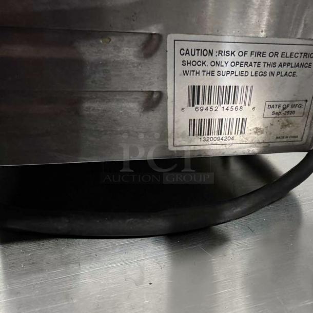 Barcode and caution label on Globe GSG14D Panini Grill. "Date of MFG: Sep 2020." Made in China.