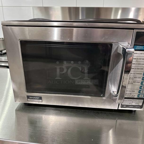 Sharp R22GTF commercial microwave oven, stainless steel, 1,200W, 20 programmable memories, excellent condition.