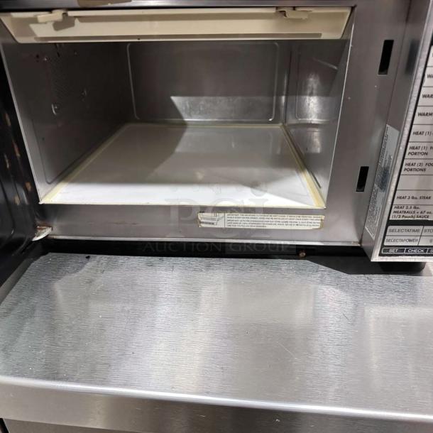 Sharp R22GTF commercial microwave oven, stainless steel, 1,200W, 20 programmable memories, open door view, excellent condition.