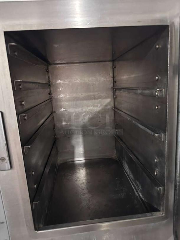 AccuTemp Steam'N'Hold S62083D150 convection steamer, 6-pan capacity, stainless steel, excellent condition, fully tested.