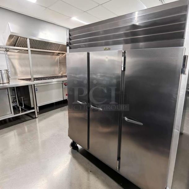 Traulsen G31310 commercial stainless steel reach-in freezer, 77" three-section solid door, elite condition, fully tested.