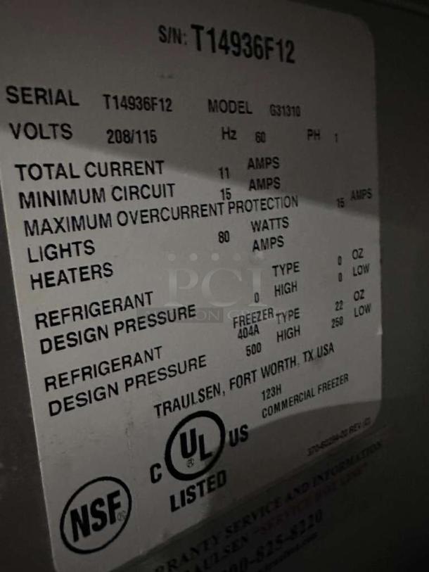 Traulsen G31310 Reach-In Freezer label showing serial number T14936F12, 208/115V, NSF and UL listed, commercial use.