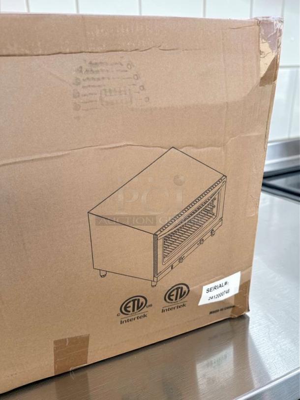 Brand new Ikon IC-824S commercial convection oven with steam, 208/240V, 4600W, stainless steel; ETL & NSF listed, serial #242000748 on box.
