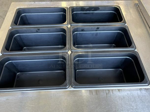 Continental Refrigerator SW60-24M sandwich prep table with six refrigerated bins. Stainless steel, exceptional condition.