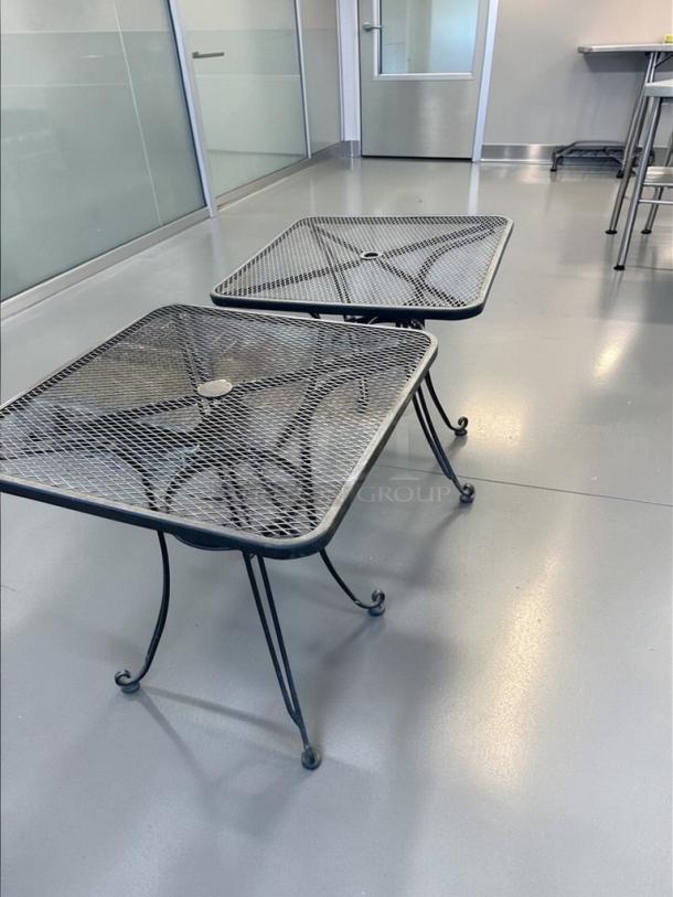 Commercial outdoor metal patio table, 32” square mesh top with umbrella hole, in outstanding condition, heavy-duty construction.