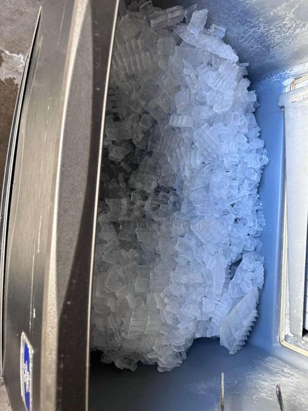 Manitowoc UY0310A-161B Commercial Ice Maker showing interior filled with ice, prime condition, fully operational.