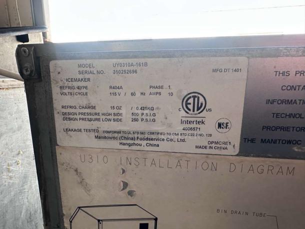 Manitowoc UY0310A-161B ice maker label showing model, serial number, specs, and certification marks.