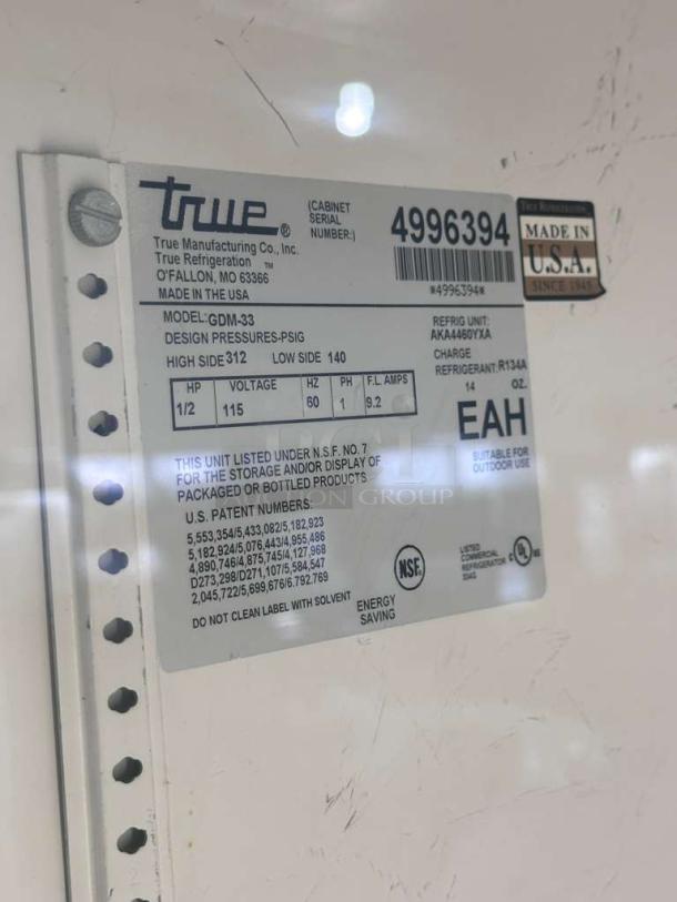 True GDM-33 Commercial Glass Door Merchandiser label, showing model, voltage, and NSF certification. Made in USA.