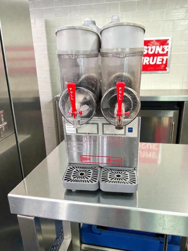 Ugolini NHT2 double bowl slush machine, superior condition, NSF & UL listed, fully operational, stainless steel base.