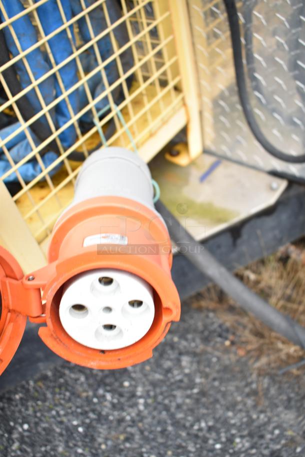 Electrical connection for a commercial mobile kitchen trailer, featuring a CaptiveAire hood and Pitco propane fryers.